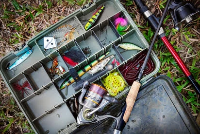 Fishing lures arranged on a tackle box